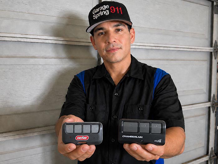 Garage door repair technician displaying a set of upgraded garage door sealed bearing rollers in San Marcos CA